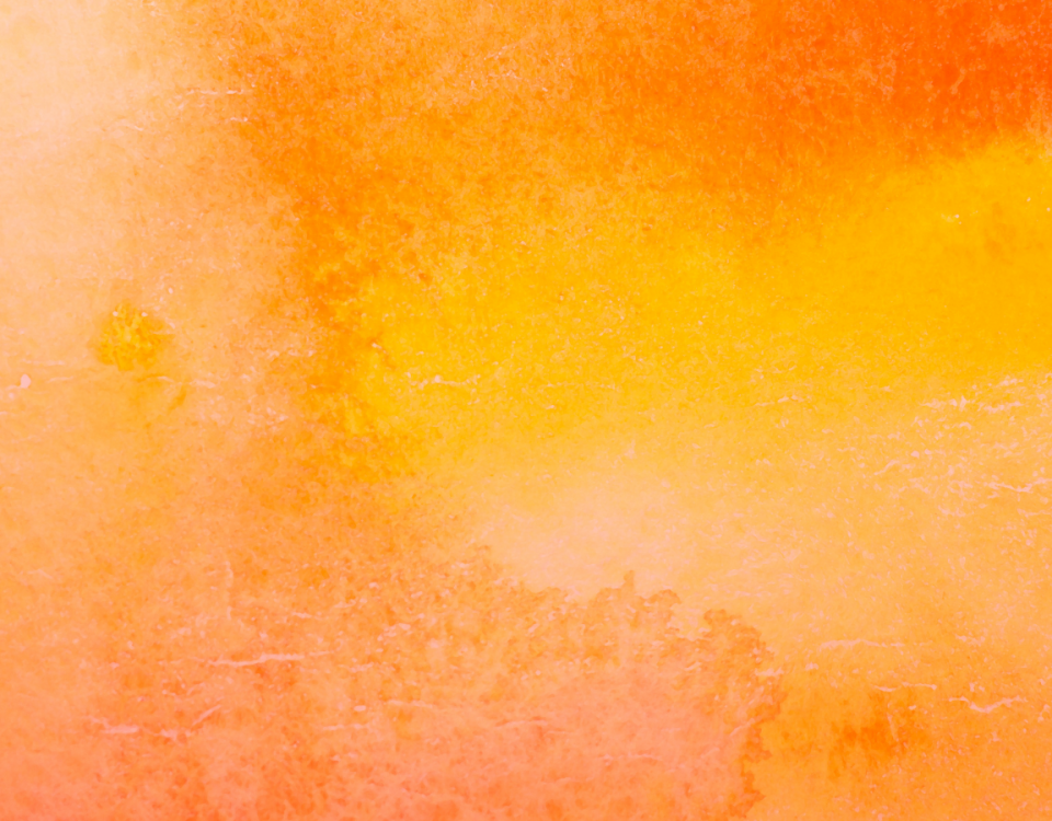 An image of different varieties of orange watercolour paint covering the entire image
