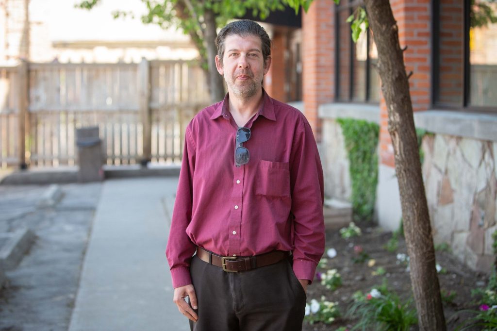 Andrew standing outside