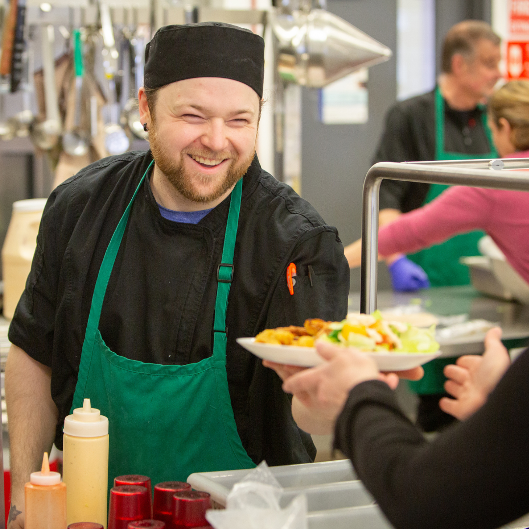 Mike serving food